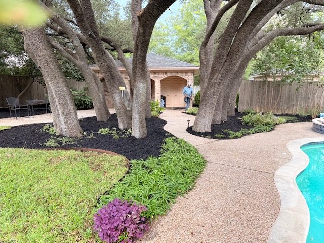 Poolside landscape bed maintenance