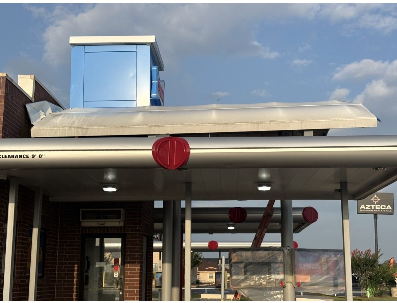 Storefront canopy before pressure washing