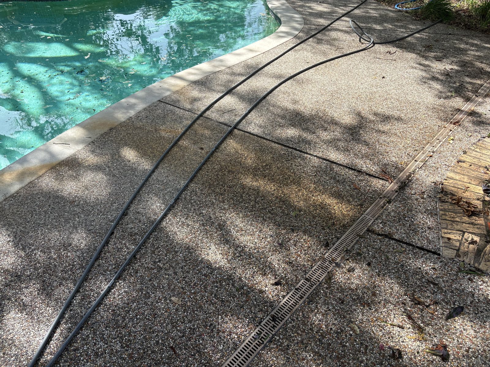 Dirty pool deck before pressure washing